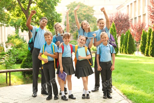 Preview: Group of children in stylish school uniform outdoors