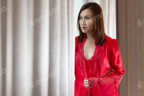 Preview: Woman in a Red Robe Posing by Curtains