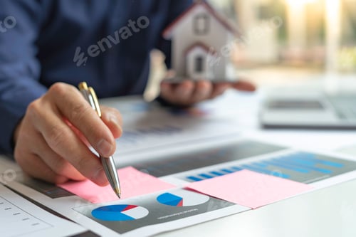 Preview: The hand of a male accountant or businessman examining the investment results. And making financial