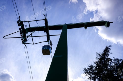 Preview: Cabins of a cable car seen from below in backlight.