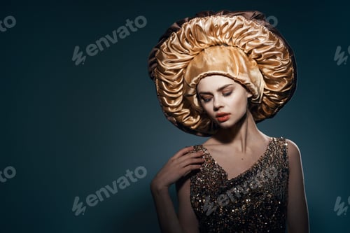 Preview: pretty woman in big golden hat vintage lifestyle glamor