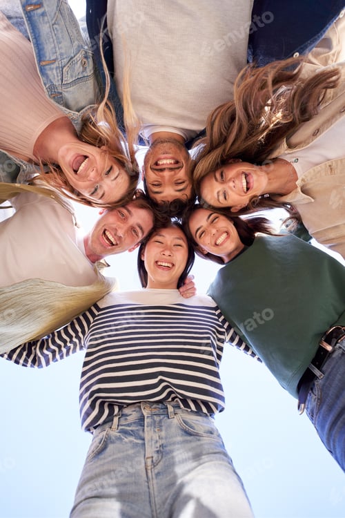 Preview: Vertical multiracial group young happy people standing in circle and smiling excited at camera.