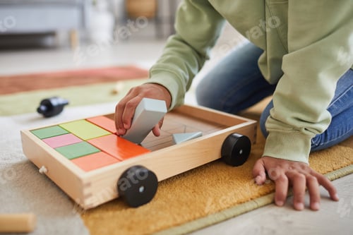 Preview: African American Kid Playing with Toys on Floor