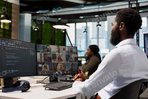 Preview: Tech company office coworkers working together via videocall