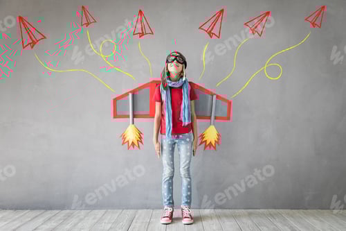 Preview: Happy child playing with toy jetpack