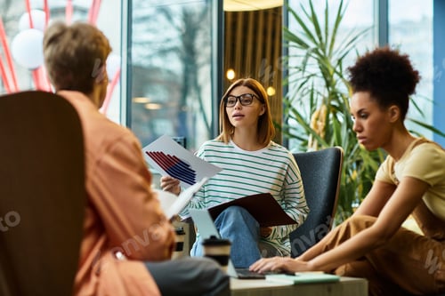 Preview: Colleagues collaborating at a hotel during a productive business trip