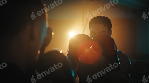 Preview: boxers fight in the ring at night