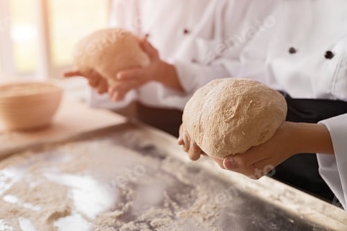 Preview: Crop bakers kneading soft dough
