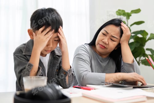 Preview: Challenges and Support. A mother comforts her son who is feeling frustrated while studying at home.