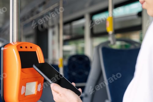 Preview: Mobile payment, paying public transport in city with smartphone.