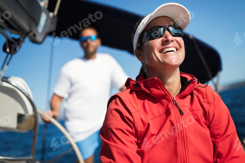 Preview: Attractive strong woman sailing with her boat