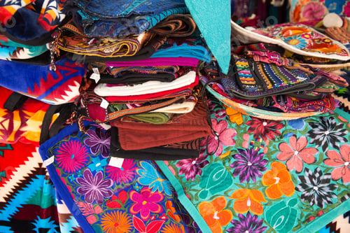 Preview: Colorful hand embroidered pillow covers at a market in Santa Fe, NM