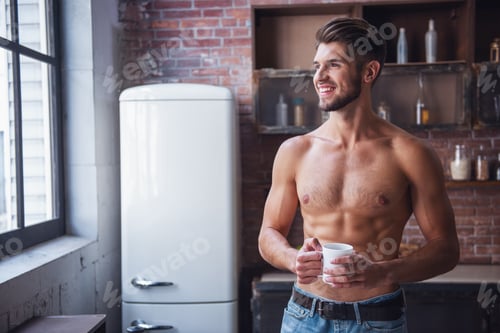 Preview: Sexy young man in kitchen