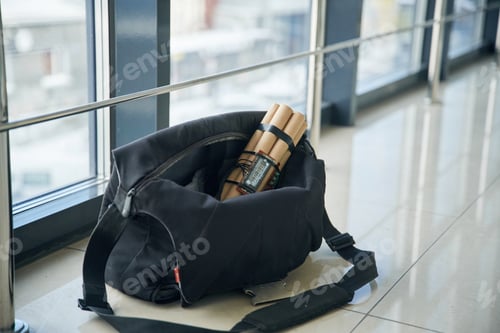 Preview: Close up view of time bomb in bag in the public place