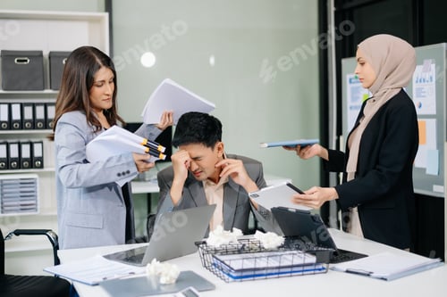 Preview: Furious Asian businesspeople arguing strongly after making a mistake at work in office