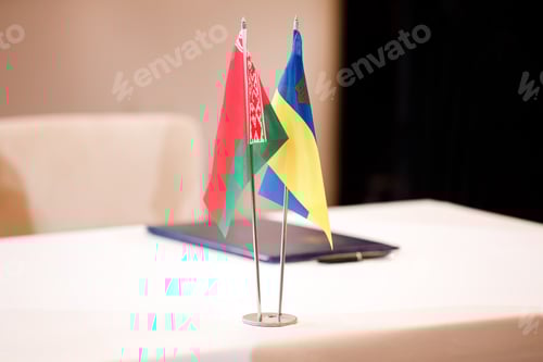 Preview: red green national flag of Belarus and blue yellow flag of Ukraine. Minsk ceasefire talks between