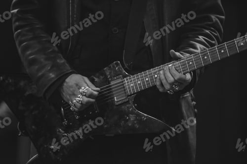 Preview: Rock musician plays the guitar. Black and white photography