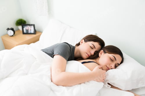 Preview: Young beautiful girlfriends asleep in a white comfy bed