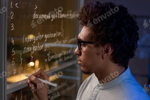 Preview: Man Writing Code On Glass Wall