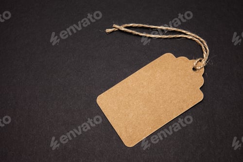 Preview: Close-up, price tag on a black background, top view. Sales concept