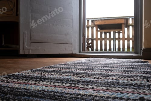 Preview: Open white door with access to the balcony, against a blurred background table.
