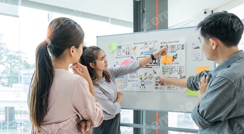 Preview: group of asian ux developer and ui designer serious brainstorming about mobile app interface on