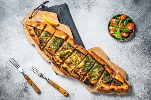 Preview: Turkish bread pide, Turkish pizza. White background. Top view