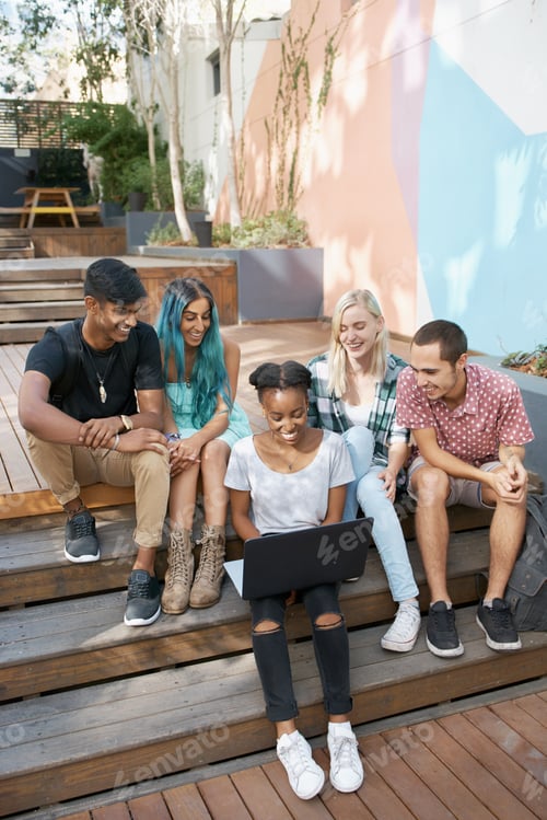 Preview: Shot of a group of young students enjoying a break outdoors on campus