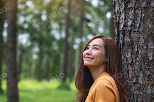 Preview: Portrait image of a beautiful young asian woman standing in the park