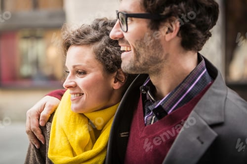 Preview: Couple hugging on city street