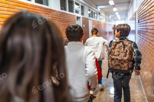 Preview: Group of elementary school students running in school hallway