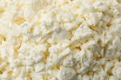 Preview: Fresh cottage cheese on whole background, close up