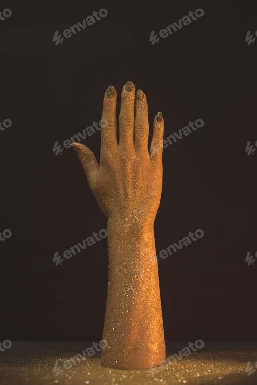 Preview: Wax hand in golden glitter on black