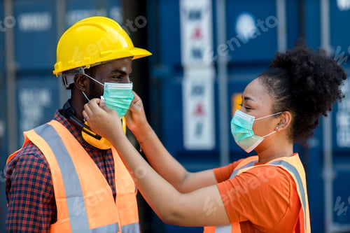 Preview: Wife puts a medical mask on her husband before work. Coronavirus, illness, infection, quarantine