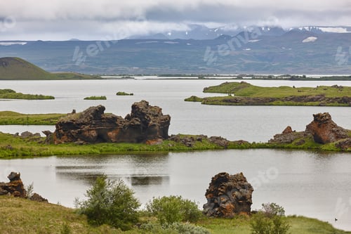 Preview: Basalt formations into the lake in Myvatn area. Icelandic landscape