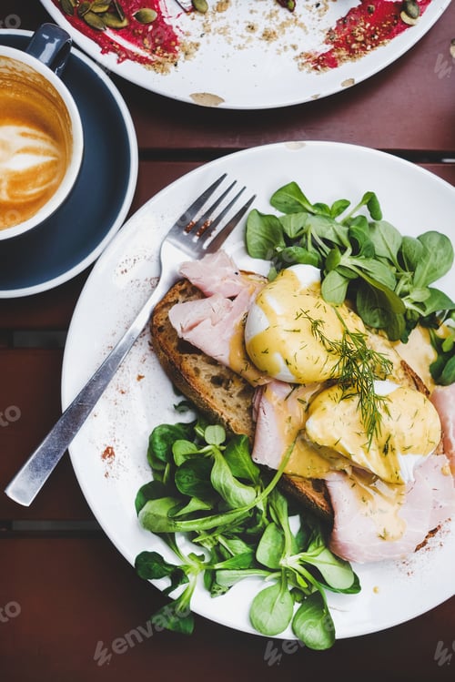 Preview: Breakfast with poached eggs on bread with salad and ham