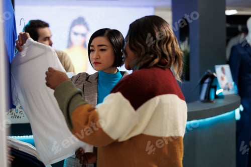 Preview: Girlfriends shopping in clothing store