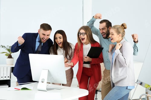 Preview: Group of office employees celebrating victory at workplace