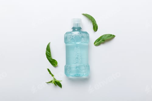 Preview: Mouthwash and fresh mint on colored background, top view with copy space for text
