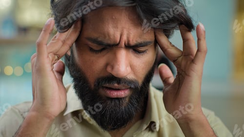 Preview: Arabian Muslim unhappy bearded man unhealthy guy businessman stressful executive massaging temples
