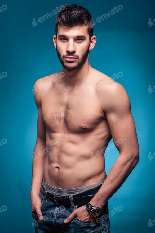 Preview: Handsome Man, Shirtless, Hands In Pockets, Blue Background