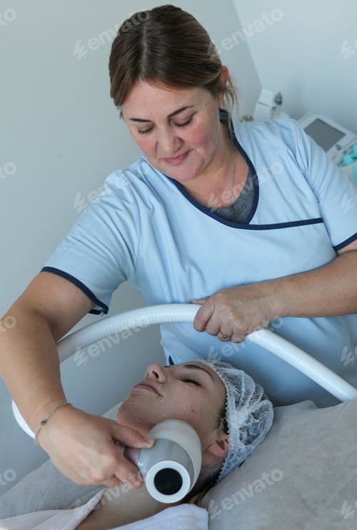 Preview: Young Woman Receiving Cryotherapy and Radio Frequency Facial Treatment at Modern Beauty Clinic