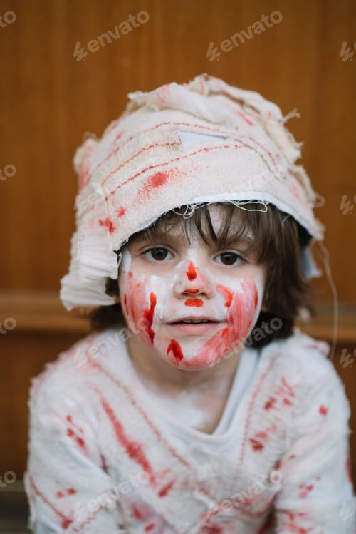 Preview: Little boy dressed in mummy in the street