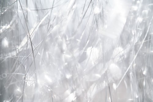 Preview: Light grey and white tinsel background with bokeh for Christmas.