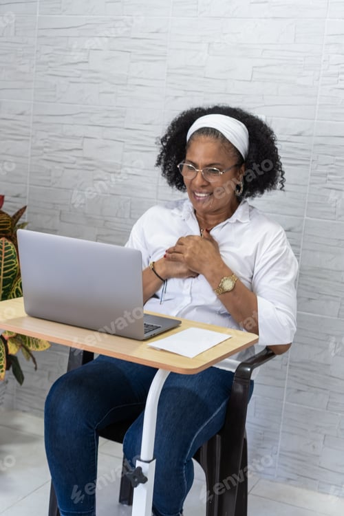 Preview: Happy woman celebrating university acceptance watching laptop