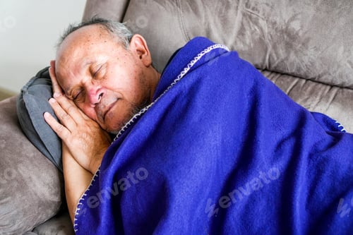 Preview: Close Up View Of Senior Old Man Sleeping On Sofa Wearing Blanket