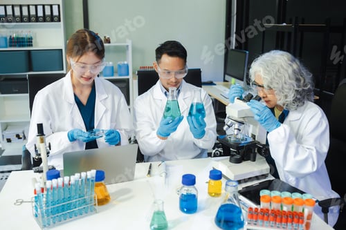 Preview: Scientist mixing chemical liquids in the chemistry lab.