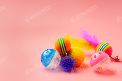 Preview: Pet toys on pink background studio shot