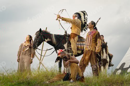 Preview: cowboy on his horse during the run of the horses in background