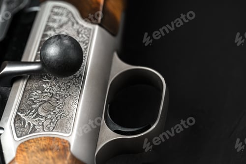 Preview: Metal trigger on hunting gun on black background